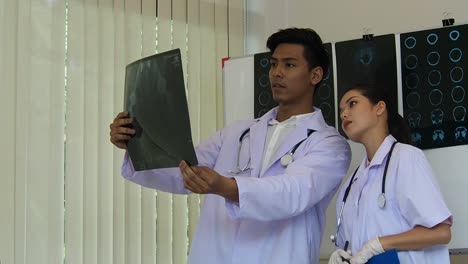 Two-doctors-are-consulting-about-X-ray-film-result