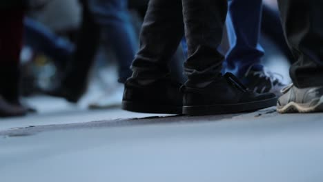 Crowd-feet-in-120fps.-Legs-of-Crowd-People-Walking-on-the-Street-in-slow-motion