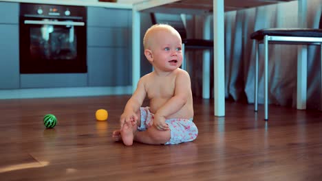 Crying-cute-little-girl-sitting-on-the-floor-at-home