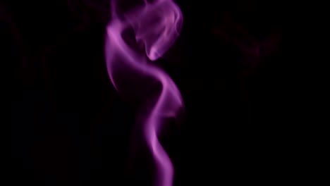 Purple-Steam-Rises-from-up.-Blue-smoke-over-a-black-background.-Smoke-slowly-floating-through-space-against-black-background.-Slow-Motion.