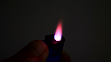Cigarette-lighter-lighting-flame-slow-motion