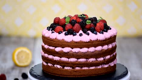 Chocolate-cake-decorated-with-berries.-Summer-berry-cake.