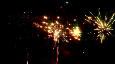 Bright-fireworks-on-the-background-of-the-night-sky-on-New-Year's-Eve.-Looped