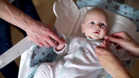 Mother-and-Father-Playing-with-their-Cute-Baby