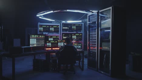 Hacker-using-computer-with-multiple-monitors