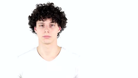 Pointing-on-Side,-Young-Man-with-Curly-Hairs,-white-Background