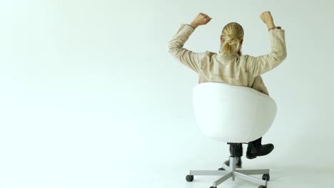 Slowmotion-of-Bearded-businessman-have-fun-turning-on-office-chair-on-white-background