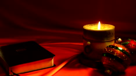 Bible-and-Candle-Video-on-Red-Background