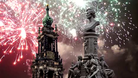 Sculpture-on-the-Bruhl-Terrace-and--Hofkirche-or-Cathedral-of-Holy-Trinity-and-holiday-fireworks---baroque-church-in-Dresden,-Sachsen,-Germany