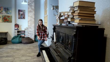 Young-girl-furtively-touches-piano-key