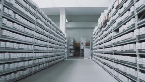 Bright-storehouse-shelves-full-of-white-boxes-with-numbers-markings