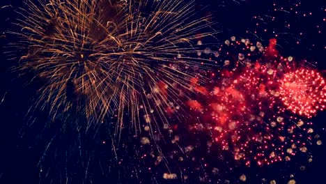 Red-firework-bursts.-Big-firecracker-bursts-in-the-sky-during-celebration.