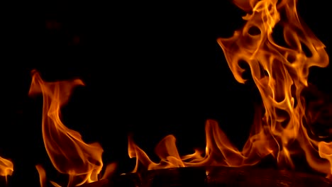 Flames-of-fire-on-black-background-in-slow-motion