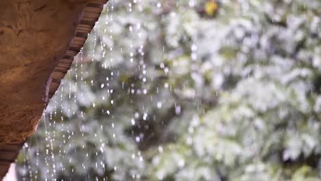 slow-motion,Rain-falls-slowly-from-the-eaves.