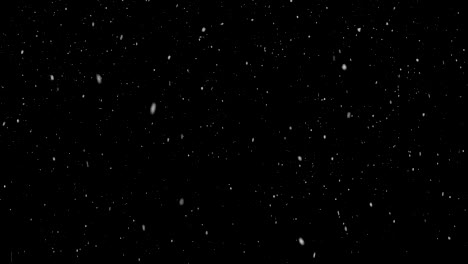 Nevada-de-invierno.-Uniforme-de-caída-de-nieve-suave-sobre-un-fondo-negro.-bucle