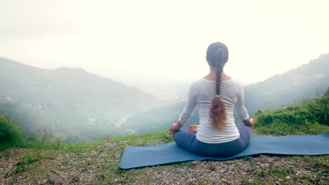 Woman-meditating-in-Lotus-asana