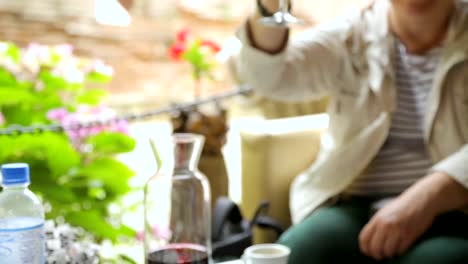 People-drinking-wine-in-street-cafe