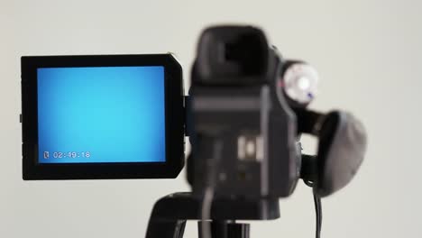 Indicators-on-the-LCD-screen-of-digital-Mini-DV-tape-camcorder-mounted-on-tripod