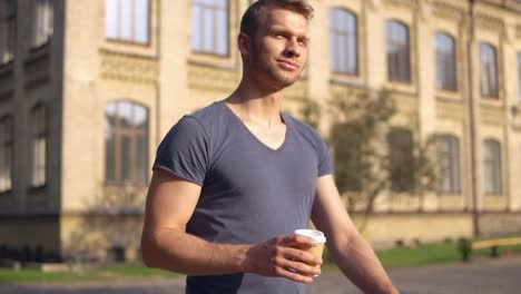 caucasian-male-walks-in-summer-town