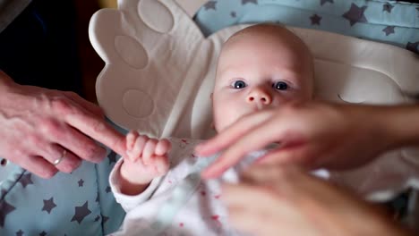 Newborn-Baby-Lying-on-a-Baby-Rocking-Chair