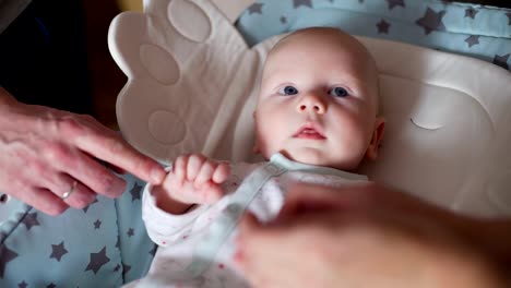 Newborn-Baby-Lying-on-the-Baby-Rocking-Chair