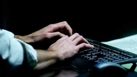 Male-hands-typing/working-on-laptop-keyboard-in-the-office-(Macro-Close-up)