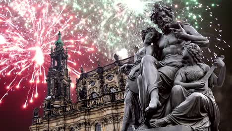 Sculpture-on-the-Bruhl-Terrace-and--Hofkirche-or-Cathedral-of-Holy-Trinity-and-holiday-fireworks---baroque-church-in-Dresden,-Sachsen,-Germany