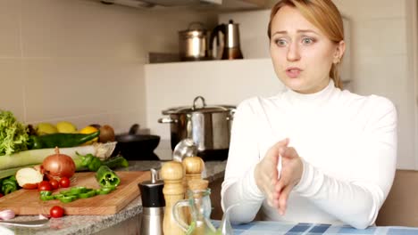 Stressed-woman-sitting-at-kitchen