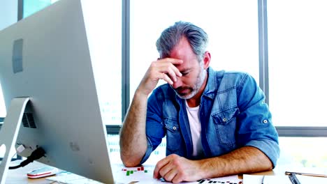 Worried-male-executive-shaking-his-head