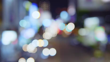 Traffic-jam-on-a-highway-at-night,-out-of-focus