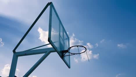 Outdoor-Basketball-cage-stand-beautiful-clouds-moving