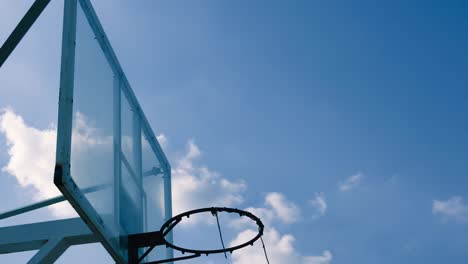 Outdoor-Basketball-cage-stand-beautiful-clouds-moving