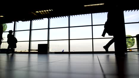 Bottom-view-of-passenger-legs-walking-at-airport-terminal,-travel,-vacation