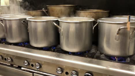 Pots-on-a-Stove-in-an-Industrial-Kitchen