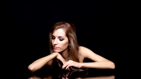 Beauty-female-video.-Blonde-woman-model-posing-at-mirror-table