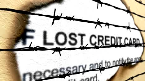 Lost-credit-card-against-barbwire