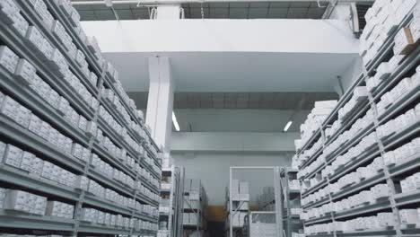 Bright-repository-shelves-full-of-white-boxes-with-numbers-markings