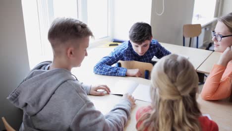 students-discussing-task-on-lesson-at-school