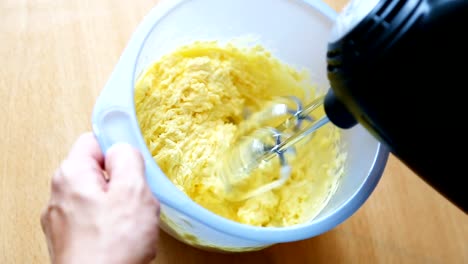 Closeup-preparation-of-whipped-cream-with-a-electric-mixer