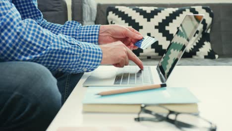 Businessman-Holding-Credit-Card-While-Typing-On-Laptop-4K