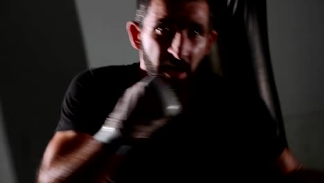 Male-bearded-boxer-exercising-shadow-boxing.