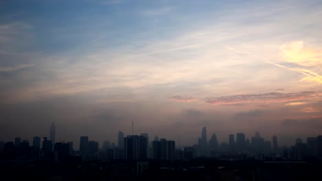 Time-lapse-from-night-to-day-with-skyscrapers-in-Bangkok-city