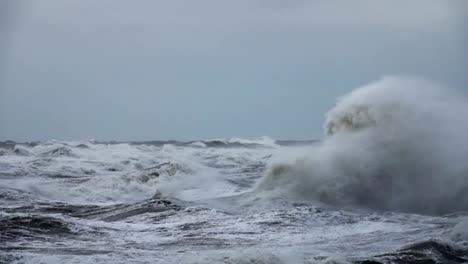 High-wave-breaking-on-the-rocks-of-the-coastline.-Extremely-Big-Wave-crushing-coast-,-Large-Ocean-Beautiful-Wave.-Super-Slow-Motion.