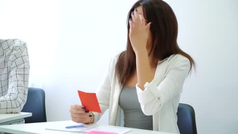 smiling-positive-female-student-answering-teacher-in-classroom