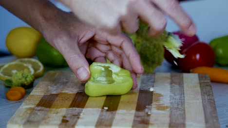 Chef-is-cutting-vegetables-in-the-kitchen,-slicing-sweet-pepper