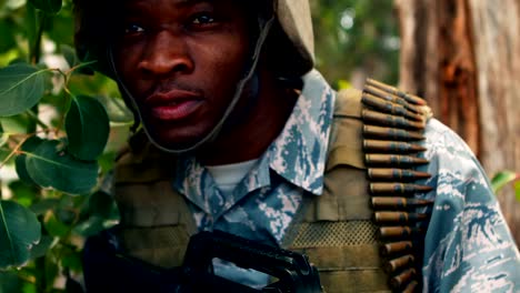 Military-man-with-a-gun-looking-around