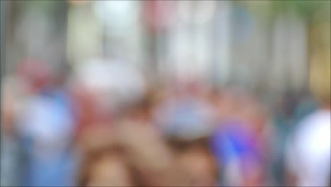 Defocused-large-group-of-people-walking-in-the-street-during-rush-hours