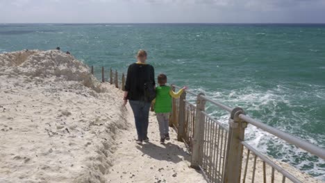 Mother-and-son-visiting-Rosh-Hanikra,-Israel