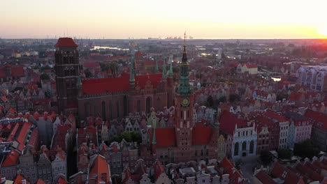 Gdansk-old-city-in-the-rays-of-the-rising-sun,-aerial-view-of-the-old-city-streets