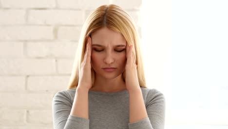 Portrait-of-Young-Woman-Gesturing-Headache,-Stress